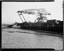 Unloading logs, 1/16/1948, #8306_1