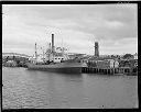 PVT. JOE R. HASTINGS at dock with lumber, circa 1947, #8428_1