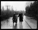 Family standing in flood water, 1/24/1935, #13933_1