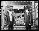 Two men in front of merchant display window, 4/23/1935, #14020_1