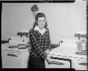 Montesano High School Home Economics teacher Mrs. Darrell Duane with range, 1/1945, #21613_1