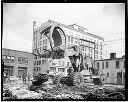 Big Kenworth rig tearing up concrete at library site, 5/29/65, #48119_1