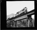 Logging train on trestle, 8/16/65, #48698_2