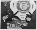 Fireman preparing for annual ball, 12/8/54, #28711_1