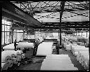 Rayonier Inc. plant interior with paper rolls, circa 1927, #403_1