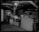 Worker wrapping bundles at Posey Manufacturing Company , 3/19/1931, #12234_1