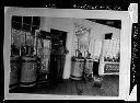 Man at Delosh's Service Station, Wishkah and K St., storefront , circa 1924, #6213_1