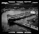 Aerial view of crane loading logs , 9/1964, #46981_1