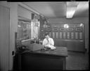 Firefighter Bill Brandt at fire alarm office, 2/2/1961, #38385_1