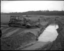 Bulldozer burying dead whale at Copalis Beach, circa 1961, #38933_1