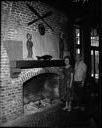 Couple by fireplace, Quinault Hotel, 6/25/61, #39439_1