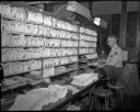 Worker sorting Christmas mail at Aberdeen Post Office, 12/1961, #40405_1