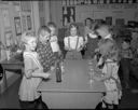 McDermoth School kindergartners playing musical glasses and bells, 2/2/1962, #40923_1