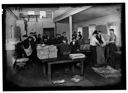 Newsboys and others loading sacks, 1926, #2062_1