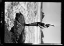 Bathing beauty June Martin on a rock, circa 1922, #3127_1