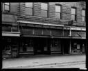 Arlington Hotel and empty storefronts, 5/15/1934, #13476_1