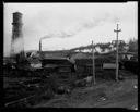 Sawmill exterior with smokestack and watertower, 11/9/1934, #13677_1