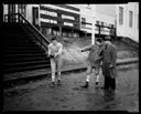 Football player with two men, 11/22/1934, #13693_1