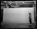 Workman with sheet of plywood, 6/5/1937, #14928_1