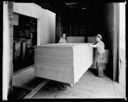 Two men with load of plywood, 6/5/1937, #14930_1