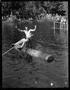 Man on chair for log rolling at Schafer Bros. Co. picnic, 7/1938, #15766_1