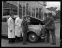 Men with diagnostic testing device at Hugh Bailey Motors, 7/15/1940, #17398_1