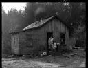 Native American women and children on porch of a house at Taholah, 1/27/1942, #19101_1