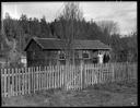 Native American home exterior with couple at Taholah, 1/27/1942, #19107_1