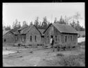 Native American couple on porch of house at Queets, 1/30/1942, #19119_1