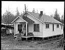 Queets house with Native American family on porch, 1/30/1942, #19125_1