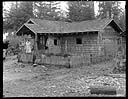 Native American family on porch of house in Queets, 1/30/1942, #19127_1