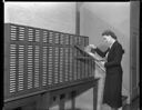 Woman with NB of C file cabinet, 9/23/1938, #15974_1