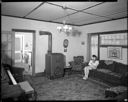 Native American home interior with woman at Taholah, 1/27/1942, #19112_1