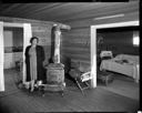 Native American home interior with woman at Taholah, 1/27/1942, #19114_1