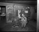 Native American woman and child in house at Oakville, 2/4/1942, #19142_1