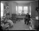 Native American man in room with basket making materials at Oakville, 2/4/1942, #19146_1