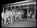 YMCA dance with teens entering, photo for The Quinault, 2/19/1960, #36082_1