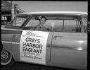 Kathleen Craig,  Miss Grays Harbor 1960 leaves for Seattle in a Chevrolet Impala, 7/19/1960, #37278_1