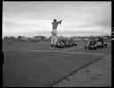 Starter leaping at Go Cart races, 7/31/1960, #37416_1