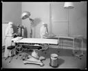 Nurses with oxygen tank and mask in St. Joseph Hospital operating room , 9/11/1946, #22679_1