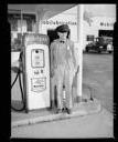 Bob Lantz' Mobil station gas pump and attendant, 4/2/1953, #27235_1