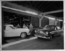 Ramsay Motors employees unloading boxcar, June 1950, #25451_1