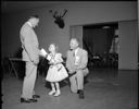 Child receiving leg brace, Elks Convention, 6/23/1955-6/25/1955, #29506_1