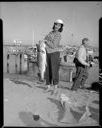 Woman with fish at Westport Salmon Derby, 8/21/1955, #29831_1