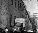 Moving out old linotype machine, 3/9/1956, #30683_1