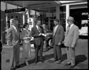 Airline ticket presentation to Stan & Beverly Hood at Stan Hood Service Station, 9/4/1956, #31480_1