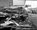 Man burning debris of old Up & Up Tavern, 9/15/1956, #31502_1