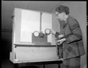 Gertrude Backstrom testing marksmanship at firing range, 11/29/1956, #31766_1