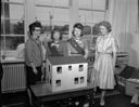 Girl Scouts presenting dollhouse, 6/13/1963, #43691_1