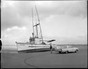 Fish boat ATICA aground at Westport with sheriff, 4/11/1964, #45873_1